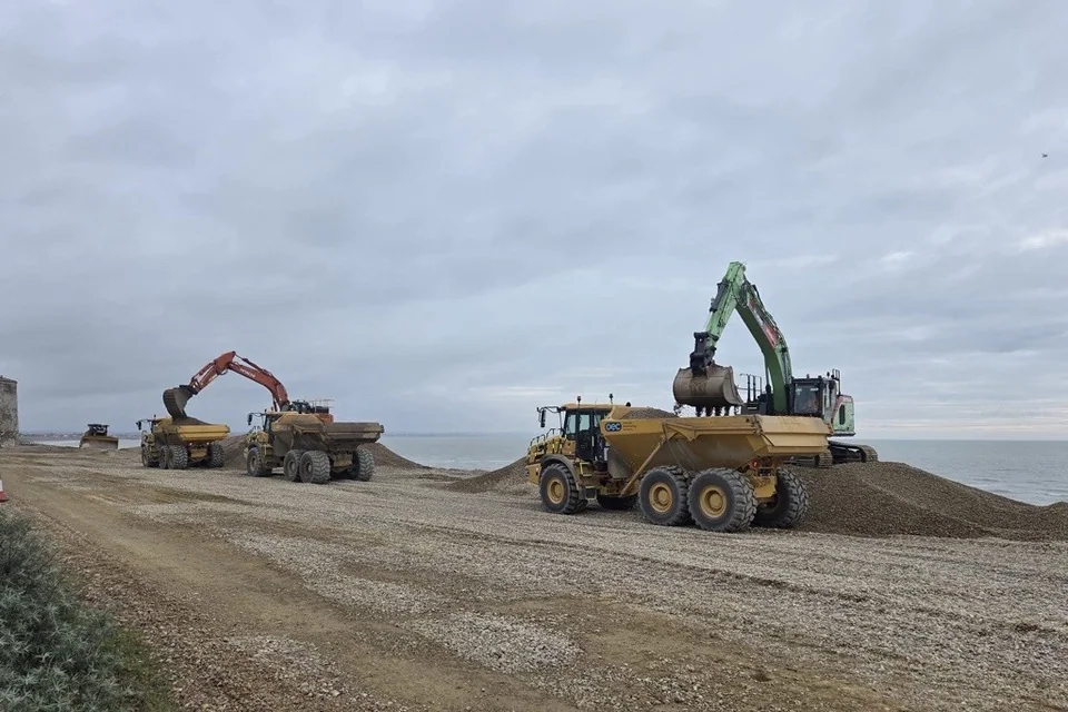 Excavators and dump trucks working on a shingle beach in the Environment Agency’s Electric October report.